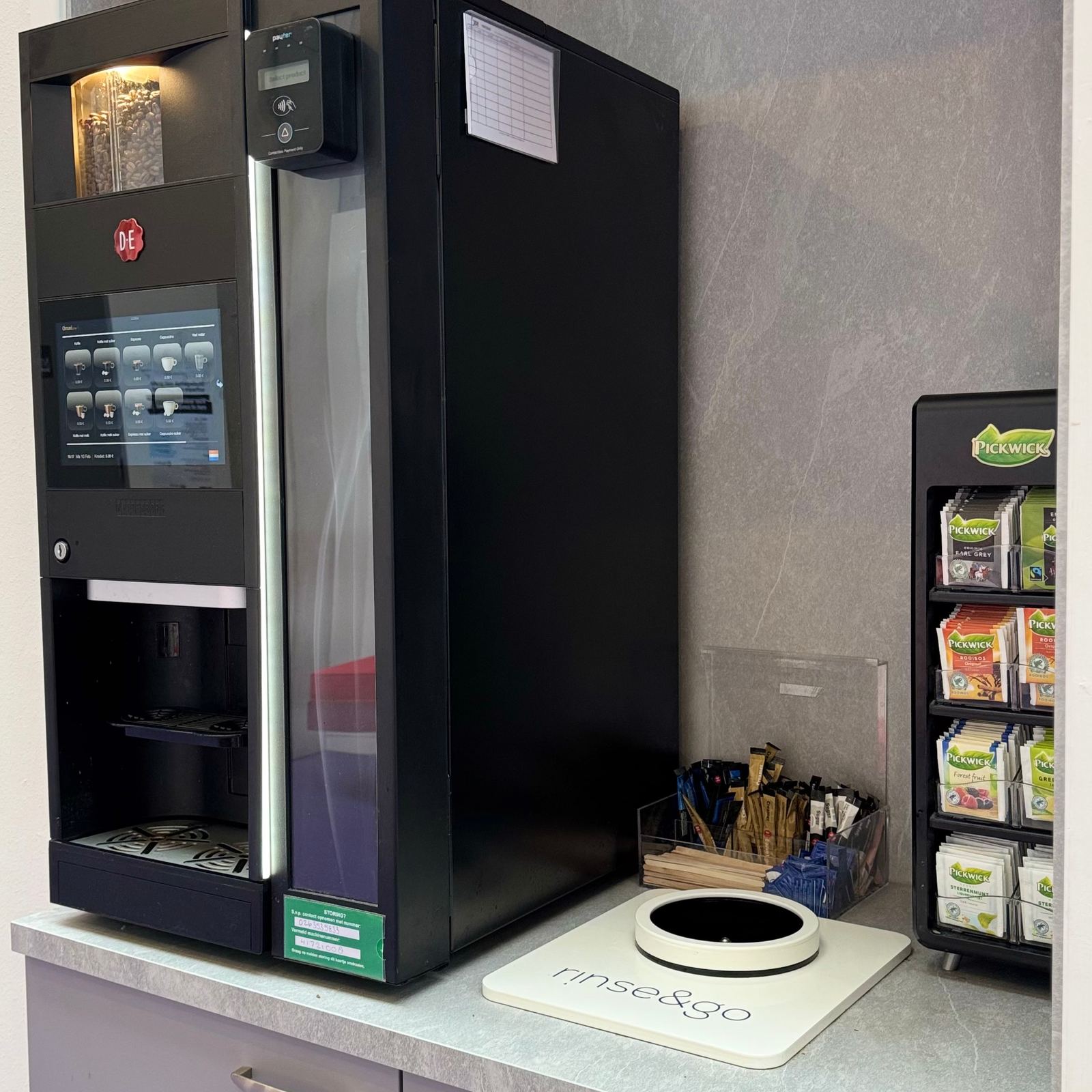 A Rinse&Go rinsing station on the countertop next to the coffee machine at ArtEZ